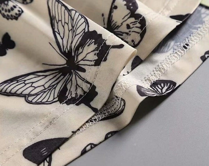 シャツ 女性 | オフホワイト バタフライ柄 ハイネックトップス